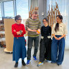 Four people in an arts studio